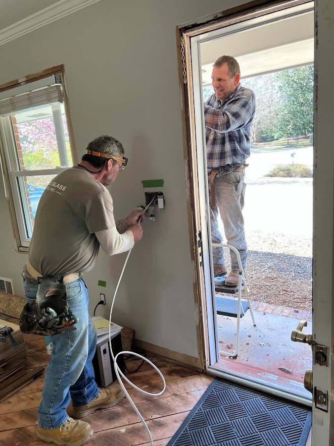 Glass Electric technicians working on electrical installation